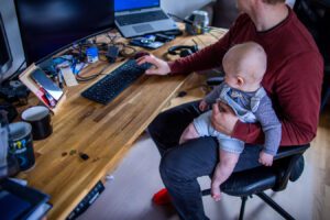 Young father in home office